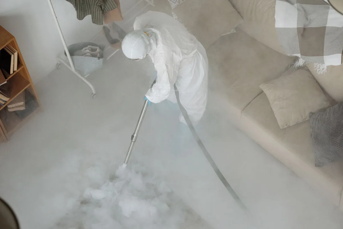Biohazard cleanup technician in protective equipment, Boscobel, WI